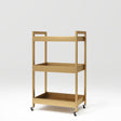 Manufakturo Beauty Trolley Assistant on Wheels Gold - displayed in a professional treatment-room setting