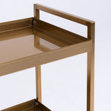 Manufakturo Beauty Trolley Assistant on Wheels Gold - displayed in a professional treatment-room setting