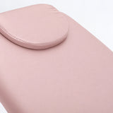 Manufakturo Chérie Bare Blush electric massage bed — close-up of the removable headrest pillow and upholstery.