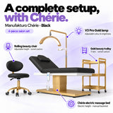 Manufakturo Chérie Black salon set features: electric bed height and manual backrest adjustment, height-adjustable rolling chair, V3 Pro Gold lamp with adjustable colour and brightness, and three-tier gold trolley.