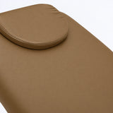 Manufakturo Chérie Caramel electric massage bed — close-up of the removable headrest pillow and upholstery.
