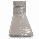Clear protective covers on the Manufakturo Chérie bed with its headrest cushion fitted, on a white background