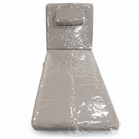 Clear protective covers on the Manufakturo Chérie bed with its headrest cushion fitted, on a white background