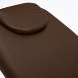 Manufakturo Chérie Cocoa Mocha electric massage bed — close-up of the removable headrest pillow and upholstery.