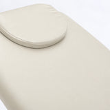 Manufakturo Chérie Creamy electric massage bed — close-up of the removable headrest pillow and upholstery.