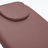 Manufakturo Chérie Dusty Rose electric massage bed — close-up of the removable headrest pillow and upholstery.