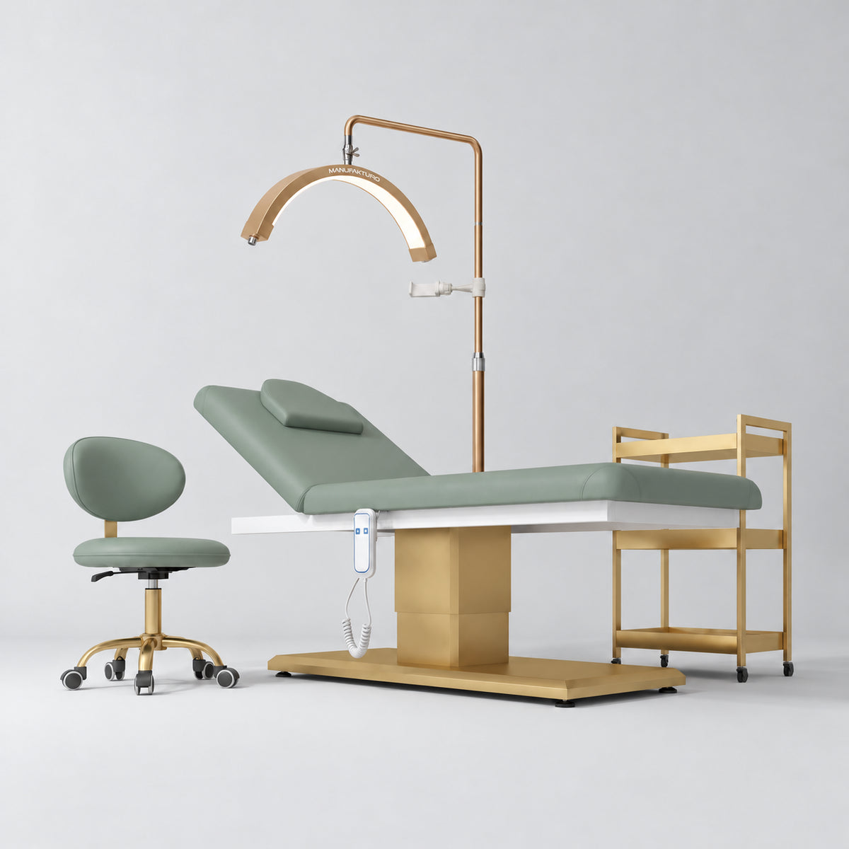 Manufakturo Chérie Olive four-piece salon set with electric massage bed, matching rolling beauty chair, V3 Pro Gold treatment lamp and empty three-tier gold trolley.