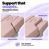 Manufakturo Divina Bare Blush spa treatment bed armrests in raised and lowered positions, showing gas-assisted adjustment and both padded side supports.