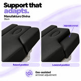 Manufakturo Divina Black spa treatment bed armrests in raised and lowered positions, showing gas-assisted adjustment and both padded side supports.