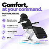 Manufakturo Éclat Black electric beauty bed with three electric motors, hand and foot controls, LED base lighting, 300 kg maximum load, one-touch descent, an extendable footrest and a solid one-piece headrest.