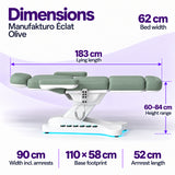 Manufakturo Éclat Olive beauty bed dimensions: 183 cm lying length, 62 cm bed width, 60–84 cm height range, 90 cm width including armrests, 110 × 58 cm base footprint and 52 cm armrest length.