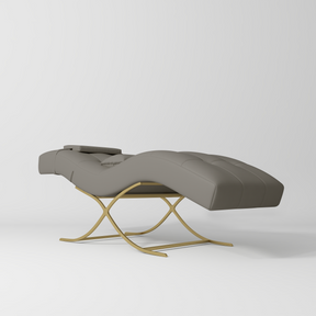 Manufakturo Elegance Lash Bed - Gold Frame & Adjustable Headrest Deep Ash - displayed in a professional treatment-room setting