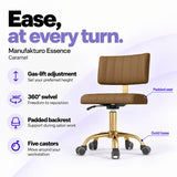 Manufakturo Essence Caramel beauty chair with gas-lift height adjustment, 360-degree swivel, padded backrest and five castors on a gold base.