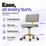Manufakturo Essence Pearl Greige beauty chair with gas-lift height adjustment, 360-degree swivel, padded backrest and five castors on a gold base.