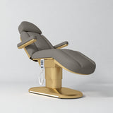 Manufakturo Étoile Deep Ash electric beauty bed in the original catalogue composition and grey background, with updated eight-button hand-held controller.