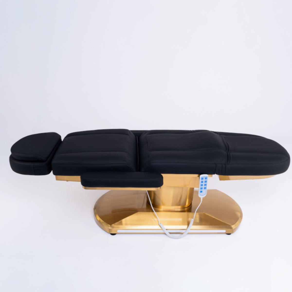 Manufakturo Étoile Electric Lash Beauty Bed - 3 Motors Black - displayed in a professional treatment-room setting
