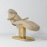 Manufakturo Étoile Warm Beige electric beauty bed in the original catalogue composition and grey background, with updated eight-button hand-held controller.