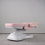 Manufakturo Grace Bare Blush electric beauty bed lying flat, with wooden armrest caps and the original white inclined lift and sculpted base.