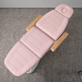 Manufakturo Grace Bare Blush electric beauty bed viewed from above, showing the segmented upholstery, face insert and wooden armrest caps.