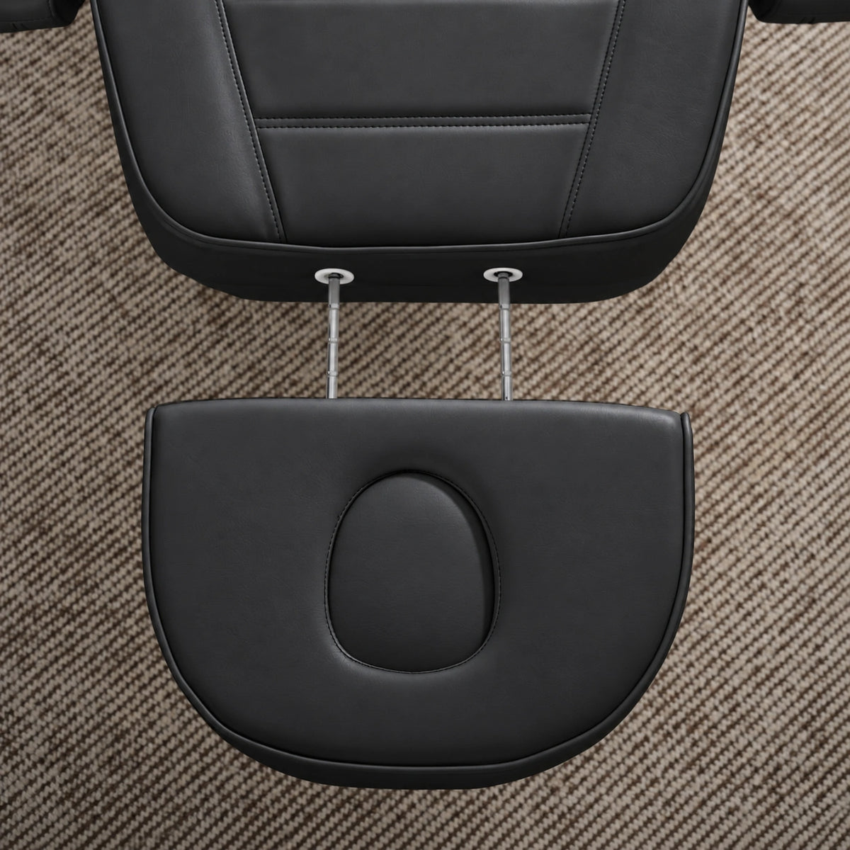 Manufakturo Grace Black electric beauty bed extended headrest with fitted face insert and two metal adjustment rods.