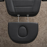 Manufakturo Grace Black electric beauty bed extended headrest with fitted face insert and two metal adjustment rods.