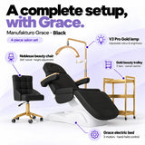 Manufakturo Grace Black four-piece salon set features: three-motor electric bed with hand-held control, Noblesse swivel chair, adjustable V3 Pro Gold lamp and three-tier gold trolley.
