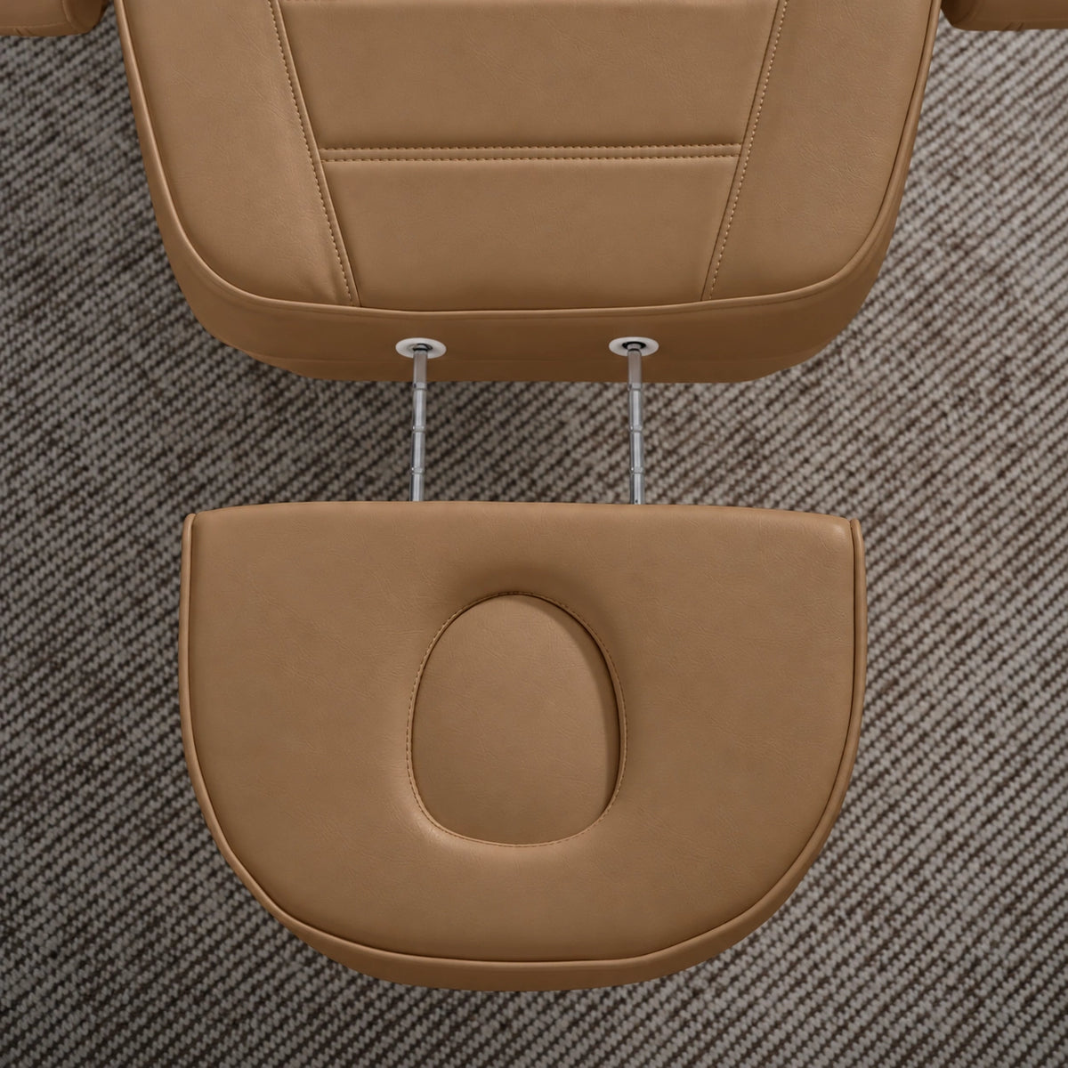 Manufakturo Grace Caramel electric beauty bed extended headrest with fitted face insert and two metal adjustment rods.