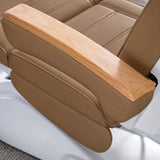 Manufakturo Grace Caramel electric beauty bed armrest detail, showing the natural wooden top and matching upholstered side cushions.