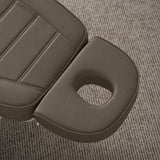 Manufakturo Grace Cocoa Mocha electric beauty bed headrest detail, showing the open massage face hole and matching stitched upholstery.