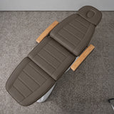 Manufakturo Grace Cocoa Mocha electric beauty bed viewed from above, showing the segmented upholstery, face insert and wooden armrest caps.
