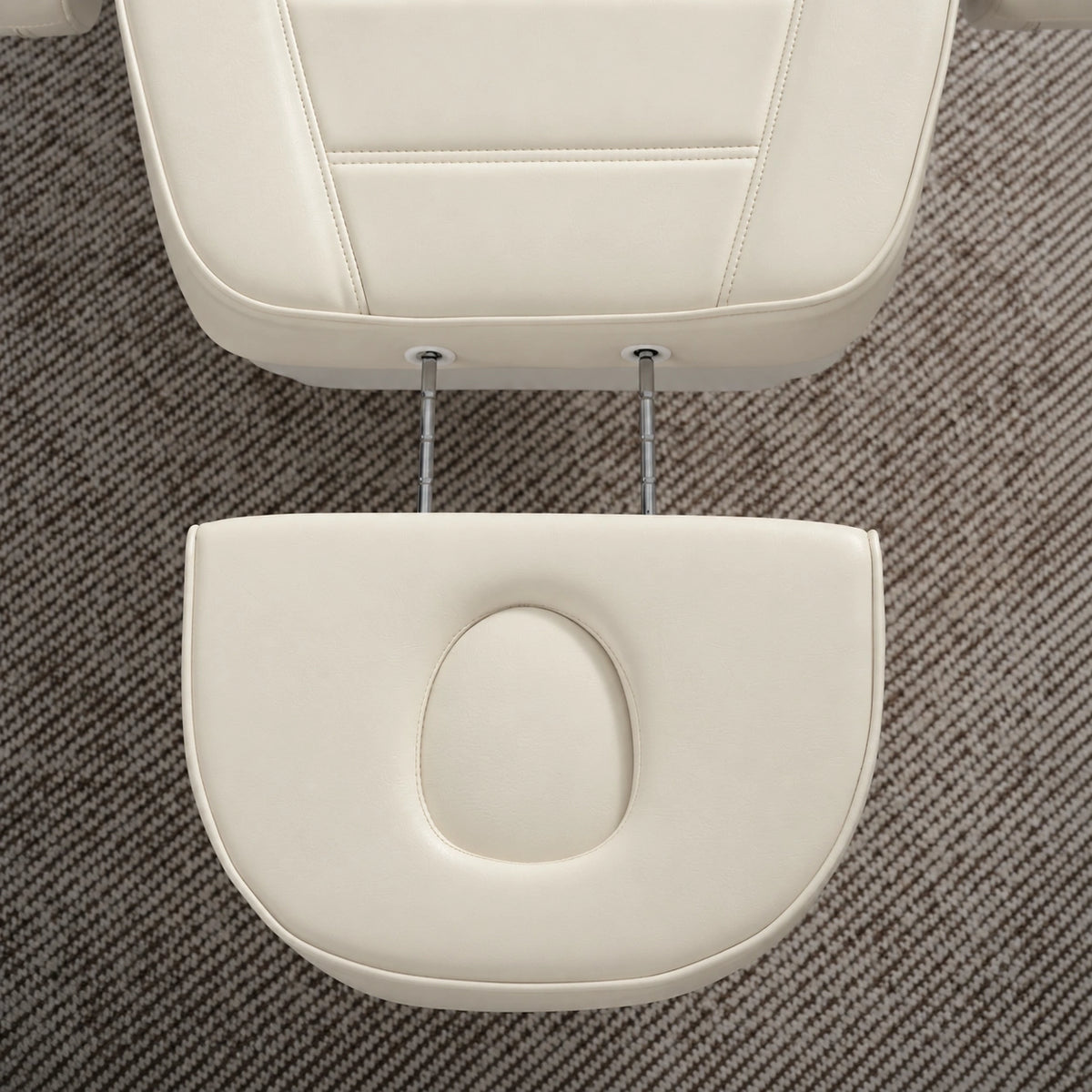 Manufakturo Grace Creamy electric beauty bed extended headrest with fitted face insert and two metal adjustment rods.