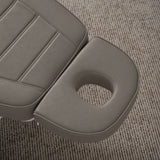 Manufakturo Grace Deep Ash electric beauty bed headrest detail, showing the open massage face hole and matching stitched upholstery.