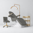 Manufakturo Grace Deep Ash complete salon set with electric beauty bed, Noblesse chair, V3 Pro Gold treatment lamp and three-tier gold trolley.