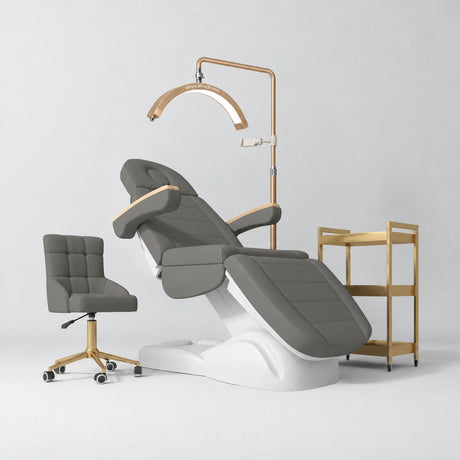 Manufakturo Grace Deep Ash complete salon set with electric beauty bed, Noblesse chair, V3 Pro Gold treatment lamp and three-tier gold trolley.