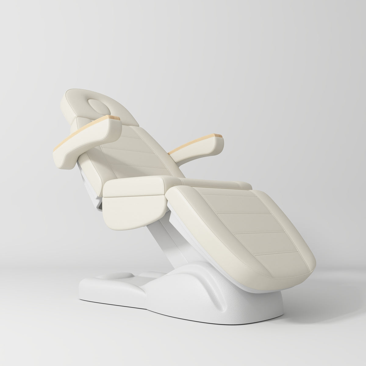 Manufakturo Grace Electric Beauty Bed - 3 Motors Creamy - displayed in a professional treatment-room setting