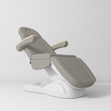 Manufakturo Grace Electric Beauty Bed - 3 Motors Pearl Greige - displayed in a professional treatment-room setting