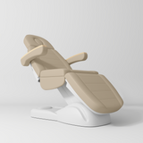 Manufakturo Grace Electric Beauty Bed - 3 Motors Warm Beige - displayed in a professional treatment-room setting