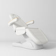 Manufakturo Grace Electric Beauty Bed - 3 Motors White - displayed in a professional treatment-room setting