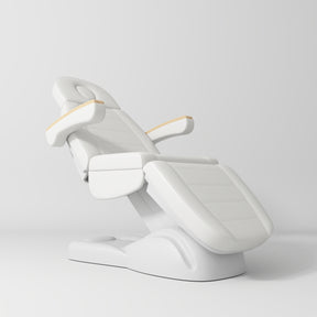 Manufakturo Grace Electric Beauty Bed - 3 Motors White - displayed in a professional treatment-room setting