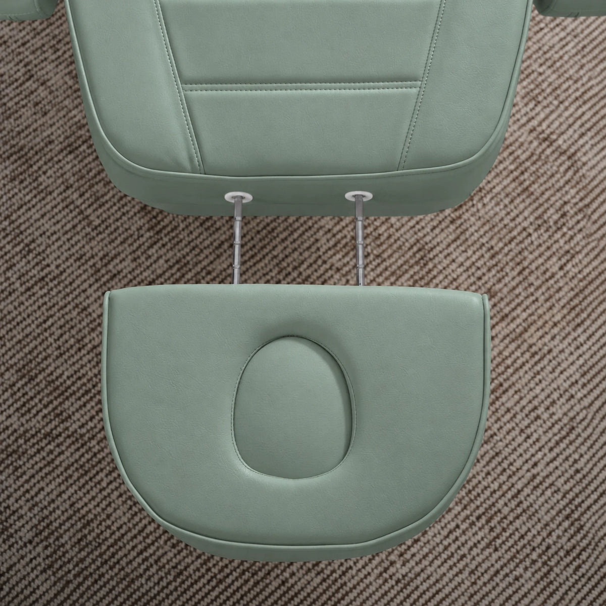 Manufakturo Grace Olive electric beauty bed extended headrest with fitted face insert and two metal adjustment rods.