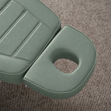 Manufakturo Grace Olive electric beauty bed headrest detail, showing the open massage face hole and matching stitched upholstery.