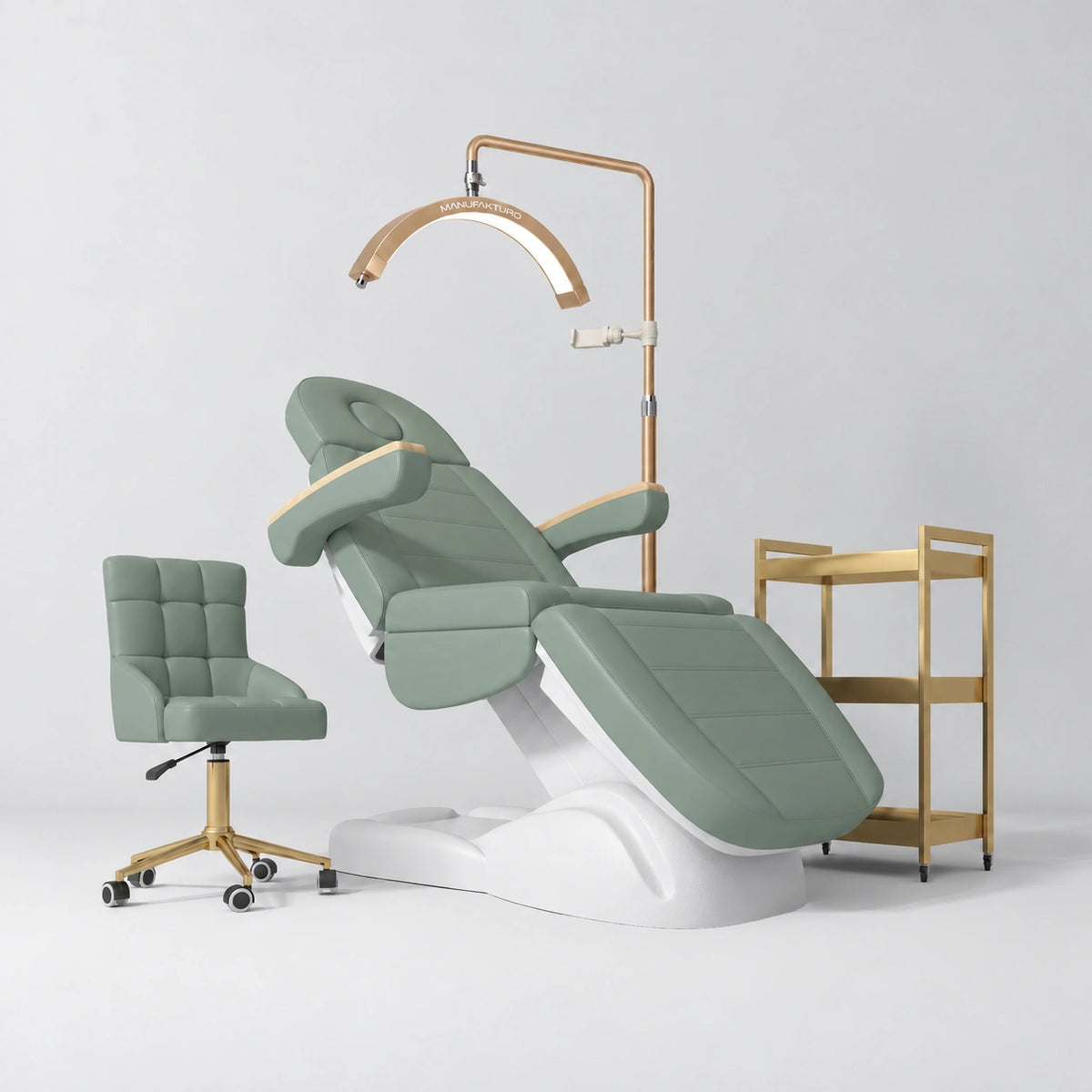 Manufakturo Grace Olive complete salon set with electric beauty bed, Noblesse chair, V3 Pro Gold treatment lamp and three-tier gold trolley.