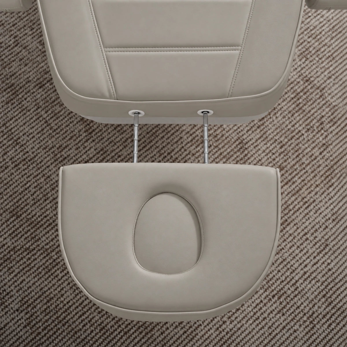 Manufakturo Grace Pearl Greige electric beauty bed extended headrest with fitted face insert and two metal adjustment rods.