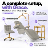 Manufakturo Grace Pearl Greige four-piece salon set features: three-motor electric bed with hand-held control, Noblesse swivel chair, adjustable V3 Pro Gold lamp and three-tier gold trolley.