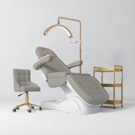 Manufakturo Grace Pearl Greige complete salon set with electric beauty bed, Noblesse chair, V3 Pro Gold treatment lamp and three-tier gold trolley.