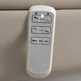 Manufakturo Grace Stone Taupe electric beauty bed hand-held control with the original buttons and indicator, against matching upholstery.