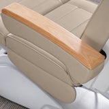 Manufakturo Grace Warm Beige electric beauty bed armrest detail, showing the natural wooden top and matching upholstered side cushions.