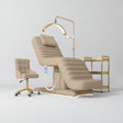 Manufakturo Grandeur Warm Beige complete studio set with beauty bed, Noblesse chair, gold trolley and V3 Pro Gold treatment lamp, photographed against the original grey studio background.
