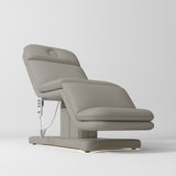 Manufakturo Heated Imperial Signature Electric Beauty Bed Pearl Greige - displayed in a professional treatment-room setting