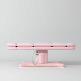 Manufakturo Imperial Signature heated electric beauty bed in Light Pink, shown fully flat from the side with matching base and white remote control.